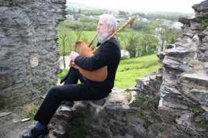 John Evans plays a set of his handcrafted pipes on the ruins of Newcastle Emlyn Castle near his home in the southwest of Wales. Evans crafts both these pipes and a type of traditional Welsh instrument called a 'pibgorn' out of wood, leather and cattle horns. (Photo courtesy of John Evans)