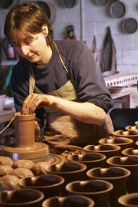 Ninth-generation potter Caitlin Jenkins throws on the wheel at Ewenny Pottery, a family-owned ceramics workshop that has been open in South Wales since 1610. One of two ceramics artists coming to this year's festival, Caitlin will be working and teaching with clay on the National Mall this summer. (Photo courtesy of Caitlin Jenkins)