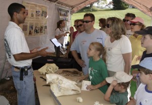 Enthralled visitors talk with a scientist at the 2007 Autum Conservation Festival. (Photo by Mehgan Murphy)