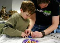 McDonald shows a student how a feather is 'born' by making a clay model. (Photo by Kirsten Bauer) 