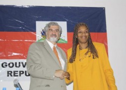 Richard Kurin, left, the Smithsonian's Under Secretary for History, Art and Culture, shakes hands in agreement with Minister of Culture Marie-Laurence Jocelyn Lassègue to preserve Haiti's cultural heritage.