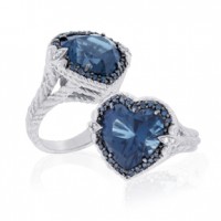 Sterling silver ring set with a 15 carat London blue topaz heart, which is surrounded by blue diamonds and held into place by two fleur de lis prongs containing white diamonds. Total diamond weight is 0.40 carat. Designed by Judith Ripka and inspired by the Smithsonian’s Blue Heart diamond. Photo courtesy of QVC.