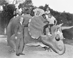 Smithsonian Secretary S. Dillon Ripley and unidentified children with "Uncle Beazley" at the opening of the Anacostia Neighborhood Museum in 1967. 