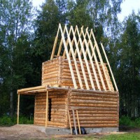 Traditional log house under construction in Mandrogy