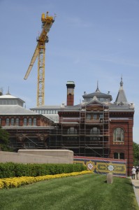 A giant crane hovers over the roof of the Arts and Industries building. (Photo by Harold Dorwin)