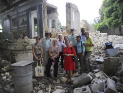 The SI-PCAH delegation visits the devastated Centre d'Art site in Port-au-Prince, Haiti, on June 21, 2011. From left, Stephanie Hornbeck (Chief Conservator, Haiti Cultural Recovery Project); Dr. Richard Kurin (Under Secretary for History, Art, and Culture; Corine Wegener (President, U.S. Committee of the Blue Shield); Eryl Wentworth (ExecutiveDirector, American Institute for Conservation); Rachel Goslins (Executive Director, President's Committee on the Arts and Humanities); Axelle Liautaud (member Centre d'Art board), Dr. Wayne Clough (Secretary); Rosa Lowinger (Conservator, St. Trinity murals project); Olsen Jean Julien (Project Manager, Haiti Cultural Recovery Project); Dr. Johnnetta Cole (Director, National Museum of African Art). (Photo by Erickson Pierre-Louis)