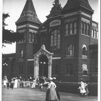 Then: The Arts and Industries Building has a special role among Smithsonian buildings—as the original home of the United States National Museum. It opened in 1881 in time for the inaugural ball of President James A. Garfield. In this 1889 image by an unknown photographer, vistors enter what is now known as the Arts and Industries Building via the North Entrance.