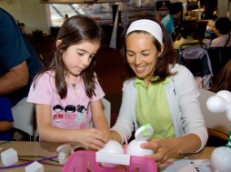 Visitors create a model of the Sputnik satellite during the Air and Space Museum's Family Day. Photo by Mark Avino