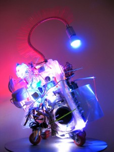 "RTI-#9," 2006. Plastic container, cable ties, LED lights, measuring cup, computer speakers, magnifying sheet, micro controller. Courtesy of Shih Chieh Huang