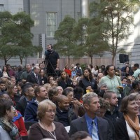 The crowd listens attentively to Dr. Clough's opening remarks.