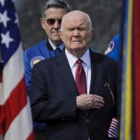 Former astronaut and U.S. Senator John Glenn holds his hand to his heart during the playing of the National Anthem at the transfer ceremony for space shuttle Discovery, Thursday, April 19, 2012, at the Smithsonian's Steven F. Udvar-Hazy Center. (Photo by NASA/Paul E. Alers)