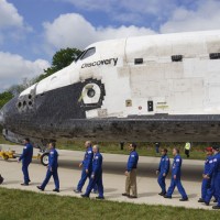 Former astronauts who flew missions on the Space Shuttle Discovery take their places for the welcome ceremony at the Udvar-Hazy Center April 19. (Photo by John Gibbons)