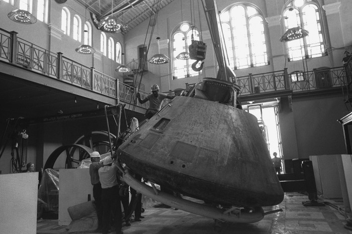 The Apollo 11 Command Module being prepared to be moved out of the Arts and Industries Building, September 1975. (Photo by Richard Farrar)