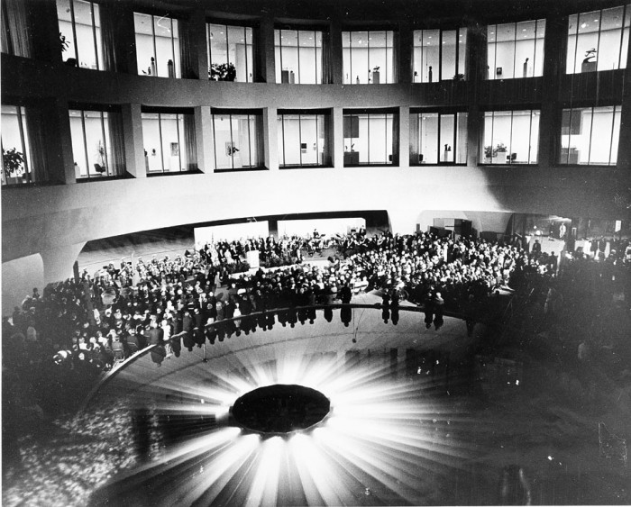 On opening night of the Hirshhorn Museum and Sculpture Garden, a crowd has gathered in the interior court around what appears to be an alien spacecraft,. (As featured in the Torch, November 1974) featured