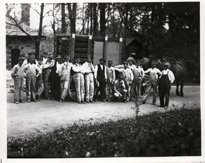 In the 1920s, the Zoo employed less than 40 staff members, all of whom were men. Pictured here are some of the Zoo keepers and other employees, posed in front of a wooden wagon used to move animals. (Historical image featured in the Torch, October 1989) 