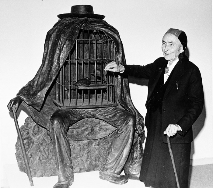 Georgia O'Keefe at the Hirshhorn Museum and Sculpture Garden (HMSG) with Rene Magritte's sculpture "Delusions of Grandeur." (Photo by Richard Farrar, as featured in the Torch, December 1977 )