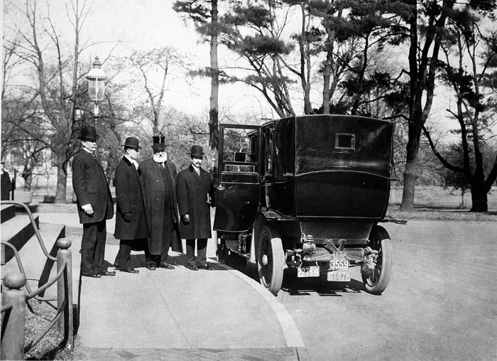 The Wright Brothers standing outside the north door of the Smithsonian Institution Castle after receiving the Langley Medal for Aerodromics, February 10, 1910. From left are: Smithsonian Secretary Charles D. Walcott; Wilbur Wright; Dr. Alexander Graham Bell, a Smithsonian regent; and Orville Wright