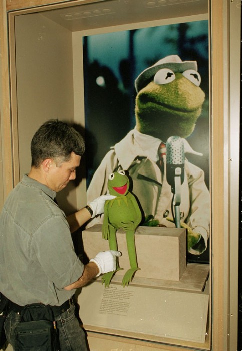 "Kermit the Frog" is placed in his display case as part of the "America's Smithsonian" exhibition at the Los Angeles Convention Center that opened Feb. 9, 1996. (Photo by Hugh Talman)