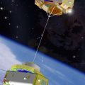 Graphic of the US Naval Research Laboratory's TiPS tether satellite. Note that only a small part of the 4 km tether is shown deployed. Via Wikipedia Commons
