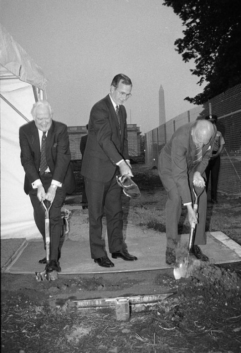 Chief Justice Warren E. Burger, Vice President George Bush, and Secretary S. Dillon Ripley at the groundbreaking ceremony for the Quadrangle Complex, June 21, 1983. The Washington Monument is visible in the background.