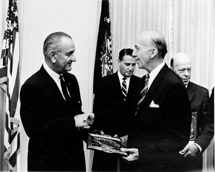 President Lyndon Baines Johnson presents a plaque symbolizing the Smithsonian Institution's 1966 Safety Award to eighth Secretary of the Smithsonian Institution (1964-1984) S. Dillon Ripley (1913-2001) at the White House on June 13, 1967. In the background are representatives of the other two winning agencies, the Federal Aviation Administration and the Department of the Navy. (Photographer unknown, as featured in the Torch, July 1967)