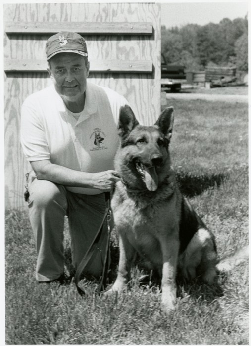 Don Bartel, trainer for the Smithsonian Institution's Office of Protective Services K-9 Unit, with Major, one of the K-9 Unit's finest. (Photo by Diane Nordeck, as featured in the Torch June, 1994)