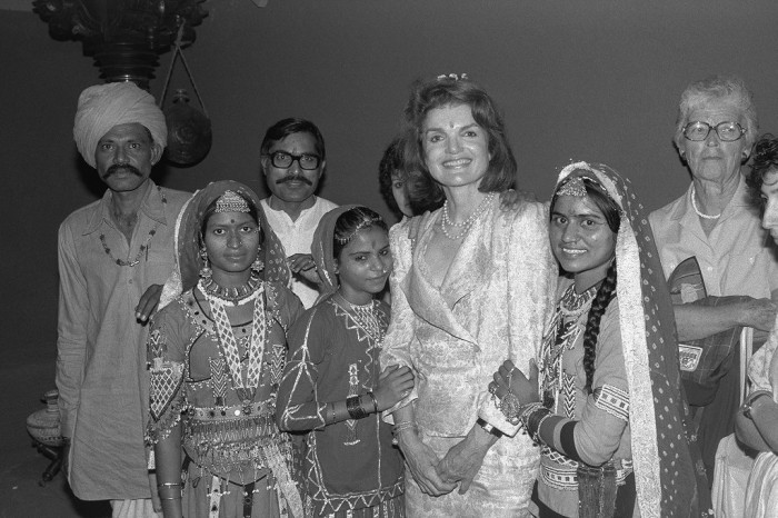 Jacqueline Kennedy Onassis with performers from India from "Aditi: A Celebration of Life" in the National Museum of Natural History on July 2, 1985