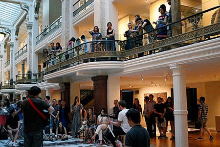 Appreciative music and art lovers line the mezzanine at the Luce Foundation Center.