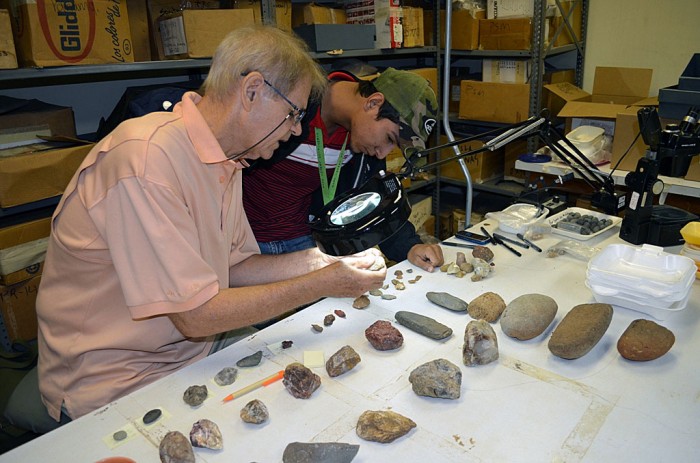 Intern Juan Gonzalez examines specimens under the guidance of staff scientist Dr. Richard Cooke at the Smithsonian Tropical Research Institute in Panama.