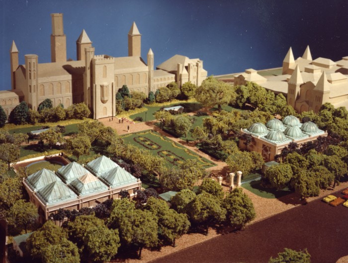 A photograph of the model of the Quadrangle, a complex of buildings that contain the Sackler Gallery, National Museum of African Art, S. Dillon Ripley Center, and the South Yard behind the Smithsonian Institution Building, or "Castle," and the Arts and Industries Building. The project of building the Quadrangle was begun in 1979. Opened in 1987, the complex, with three stories underground, is covered by the Enid A. Haupt Garden.