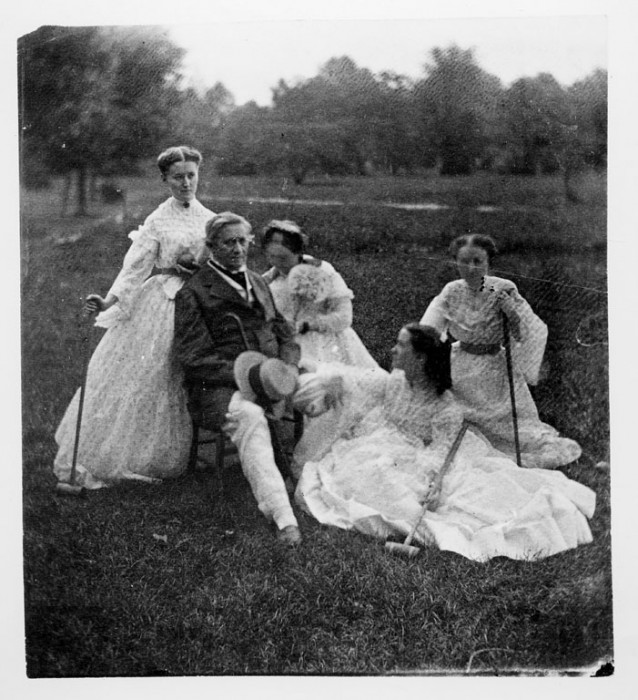 Joseph Henry, first Secretary of the Smithsonian Institution (1846-1878), and his wife, Harriet Alexander Henry, and their daughters Caroline, Helen Louisa and Mary Anna, who are holding croquet mallets, seated on the grounds of the Smithsonian Institution Building. (Photo by Titian Ramsey Peale, 1865)