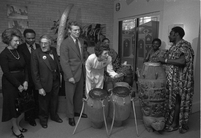 Mrs. Walter (Joan) Mondale playing the drums after a press conference at the National Museum of African Art with, from left, Rep. Lindy Boggs, Rep. Walter E. Fauntroy, Warren Robbins (founder of the Museum) and Sen. Wendell Anderson. (Photo by Richard Hofmeister, as featured in the Torch, March 1978)