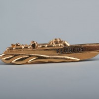A tie bar depicting PT-109, the World War II craft commanded by John F. Kennedy.