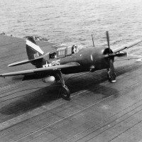 The only known VB-92 Helldiver to be photographed up close, “215” flown by Ensign Bob Sobey, illustrates the geometric symbol scheme of the squadron’s early days on USS Lexington. This photograph and others served as the guide for the Museum’s restoration project.(Photo courtesy of Robert L. Lawson Photograph Collection, National Naval Aviation Museum.)