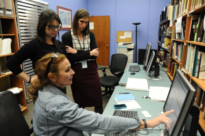 Curator Jennifer Jones explains the rapid capture process to two museum educators