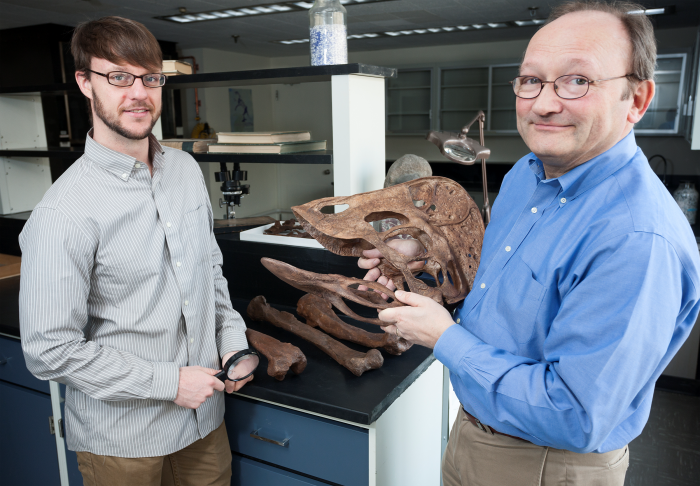 Scientists with Oviraptorsaur skull