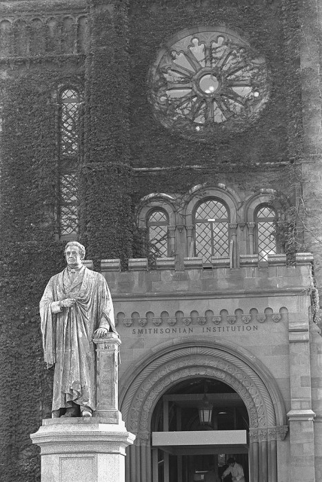 The statue of Joseph Henry, first Secretary of the Smithsonian (1846-1878) in front of the Smithsonian Institution Building, the "Castle" in 1979. The statue originally faced the Castle, however, in 1965, Secretary S. Dillon Ripley had it turned to face the Mall. (Photo by A. Pierce Bounds, as featured in the Torch supplement February 1984)