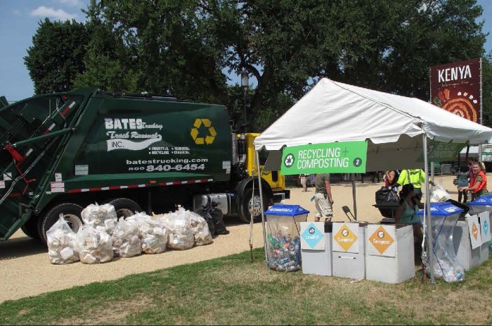 Interns and volunteers collect compost from a Resource Recovery Station at the 2014 Folklife Festival.