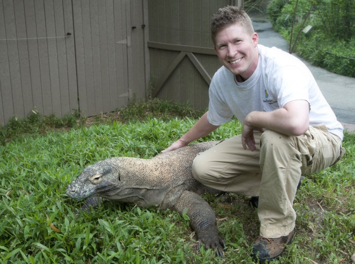 Biologist Matthew Evans with a Komodo dragon at the Zoo's Retile Discovery Center in 2011. (Photo via the Washington Post)