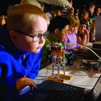 What could be better than kids, computers and robots? Children of all ages enjoy the hands-on activities at the Women in Aviation and Space Family Day at the National Air and Space Museum's Steven F. Udvar-Hazy Center. (Photo by Dane Penland)