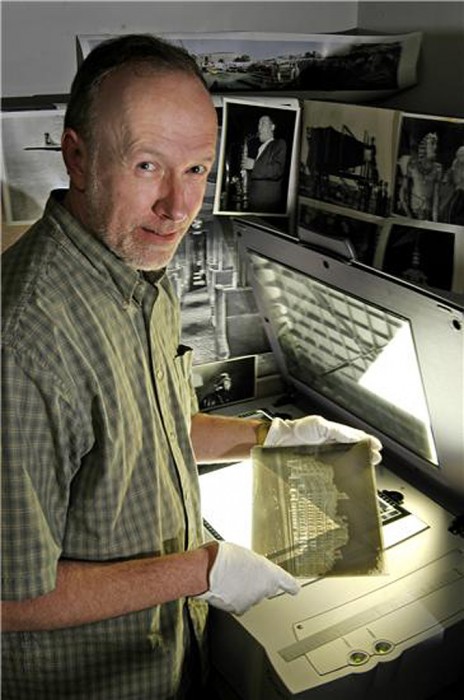 mage of John Dillaber, Digital Imaging Specialist, working in the lab at the National Museum of American History. Dillaber worked for SPS and currently now works with the Smithsonian Institution Archives. Restrictions: No restrictions