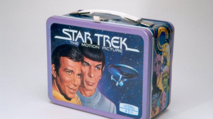 This metal lunch box was manufactured by Thermos in 1979. The lunch box features cartoon images of Captain Kirk and Mr. Spock on the front lid. The back shows the image of Captain Kirk, Mr. Spock, and Dr. Bones McCoy inside the USS Enterprise. This lunch box was based on Star Trek: The Motion Picture, the first Star Trek feature film released in 1979. (Image via the National Muiseum of American History)