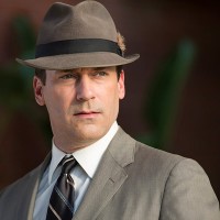 Actor Jon Hamm sporting the iconic fedora and gray suit of his alter ego, Don Draper, from the popular television show “Mad Men.” Draper’s suit and fedora, along with Betty Draper’s yellow housedress and other props were donated to the Smithsonian. (Photo courtesy AMC, Mad Men)