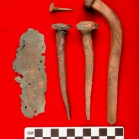 Copper fastenings and copper sheathing recovered from the São José slave ship wreck. The copper fastenings held the structure of the ship together and the sheathing provided exterior protection for the vessel. Photo courtesy Iziko Museums