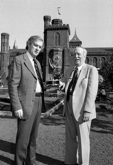 "Smithsonian World" executive producer Adrian Malone (l.) and SI television consultant Tom Wolf proudly display the Emmy Award for Outstanding Informational Series, which the series won at the September 12th Emmy Awards. 'Smithsonian World' also won an Emmy in 1985 for Outstanding Informational, Cultural or Historical Programming. (Photo by Dane Penland, as featured in The Torch, November 1987)