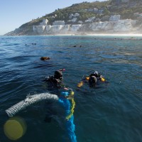 Underwater archaeology researchers on the site of the São José slave ship wreck near the Cape of Good Hope in South Africa. Photo by Susanna Pershern, U.S. National Parks Service