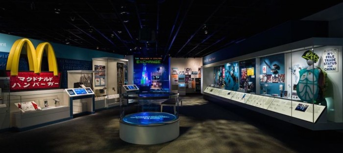 The global era section of the "American Enterprise" exhibit documents the time period between the 1980s and 2010s. In the exhibition's Exchange section, visitors of all ages can try to manage a farm, run a cat food business, resolve tough ethical dilemmas, and scale the tower of business success through cooperation or competition. (Photo courtesy National Museum of American History)