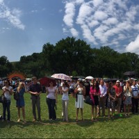 Panoramic shot of staff posing for the group picture on the National Mall June 30. (Photo by Erikson Young)