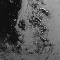 A newly discovered mountain range lies near the southwestern margin of Pluto’s heart-shaped Tombaugh Regio (Tombaugh Region), situated between bright, icy plains and dark, heavily-cratered terrain. These frozen peaks are estimated to be one-half mile to one mile high, about the same height as the United States’ Appalachian Mountains. Credit: NASA/JHUAPL/SWRI