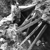 James Gidley stands just outside the entrance to the Cumberland Cave in Maryland, circa 1913. (Photo by R. Armbruster)
